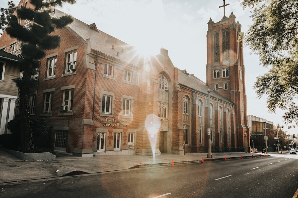 brown church under cloudy sky