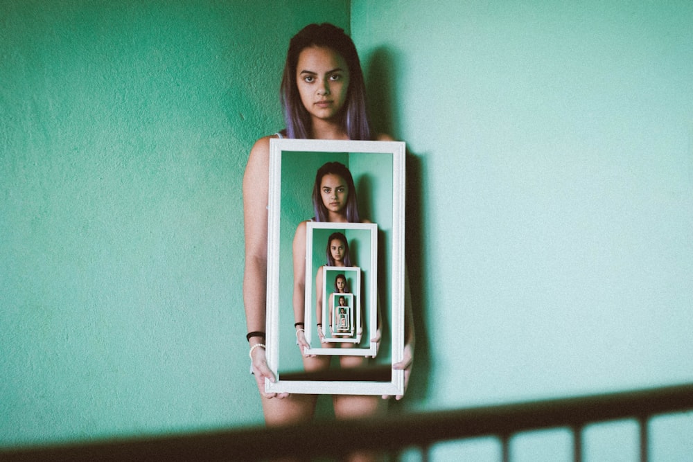 woman holding mirror