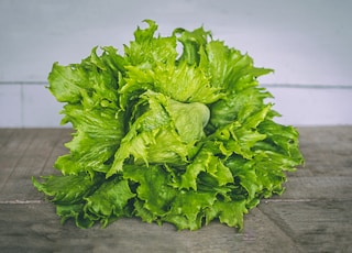 closeup photo of lettuce on gray surface