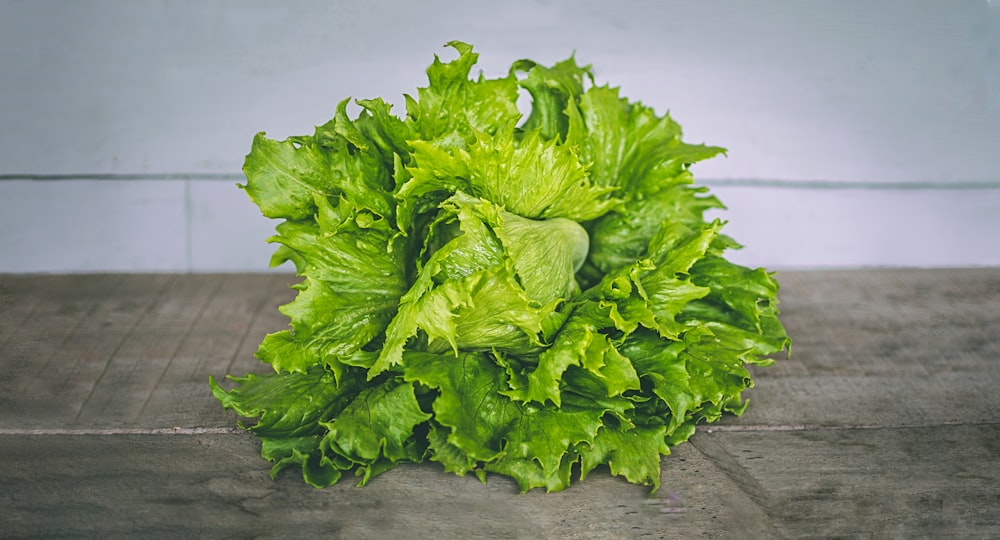 closeup photo of lettuce on gray surface