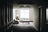 white 2-piece sofa and brown wooden coffee table