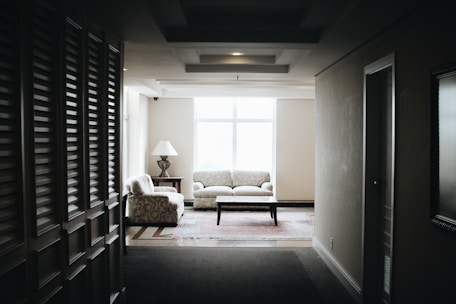 white 2-piece sofa and brown wooden coffee table
