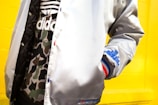 person in white jacket with hands in pocket