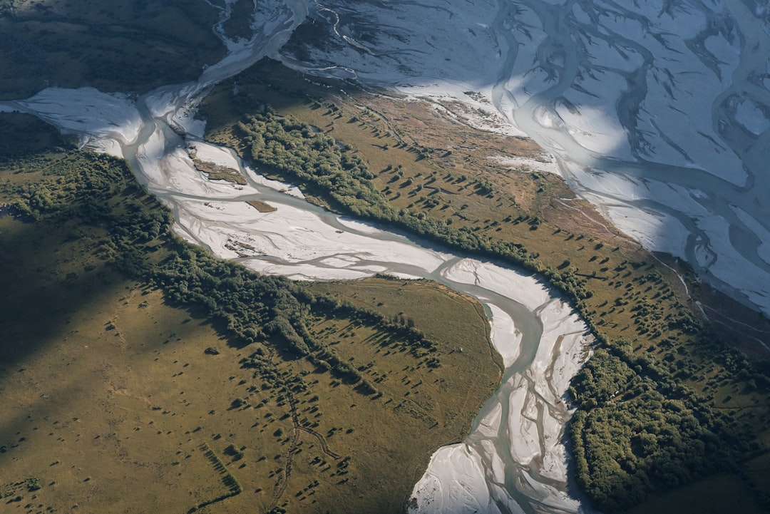 River from above feeding Lake Wakatipu Fiordland National Park in New Zealand – Bristol digital marketing - Photo by Alistair MacKenzie | best digital marketing - London, Bristol and Bath marketing agency