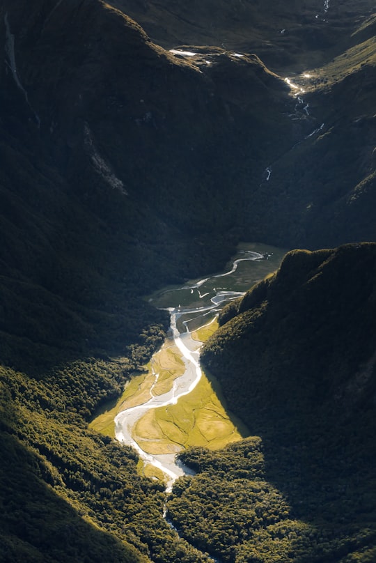 top view of river between mountains in Routeburn Track New Zealand