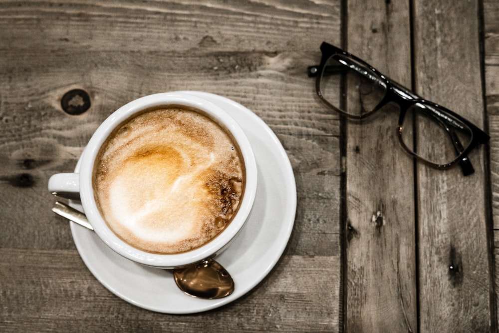 white ceramic mug filled with cappuccino