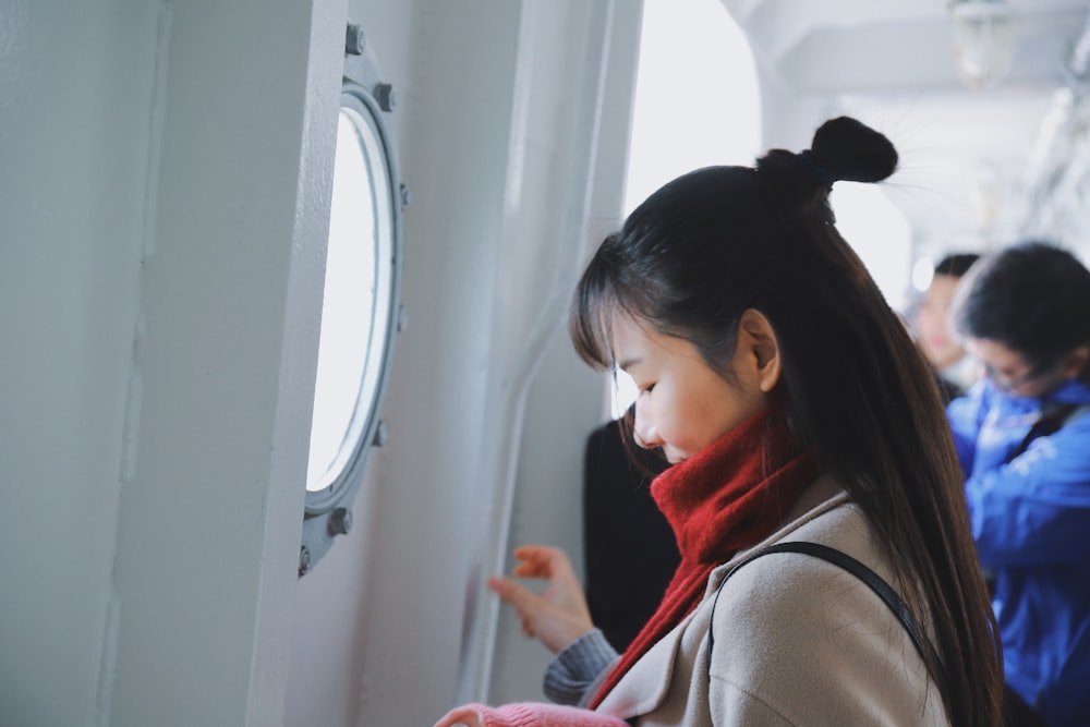 woman standing infront of window