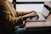 person sitting front of laptop
