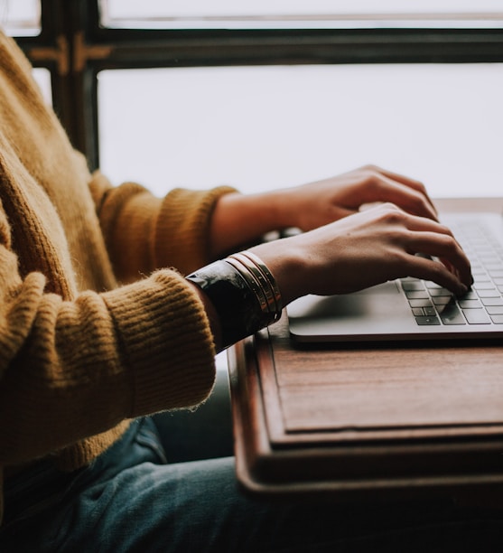 person sitting front of laptop