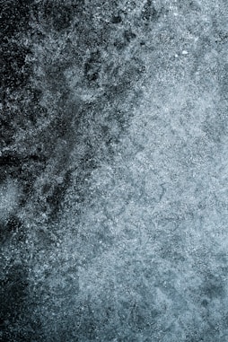 a black and white photo of snow on the ground