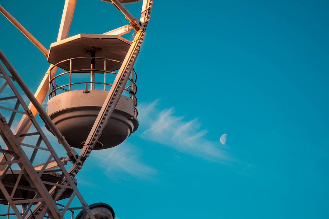 ferris wheel under blue skies