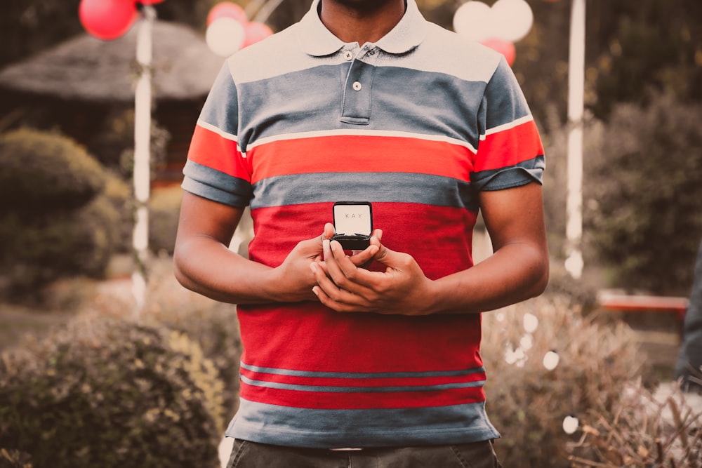 man holding ring box