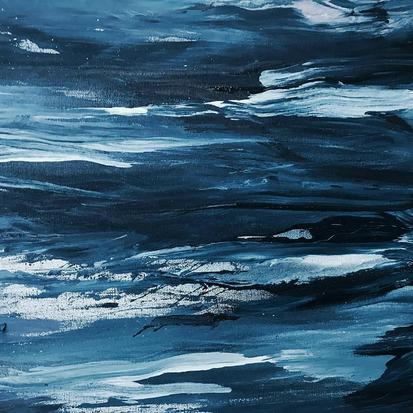 Detail of a deep blue painting of ocean waves