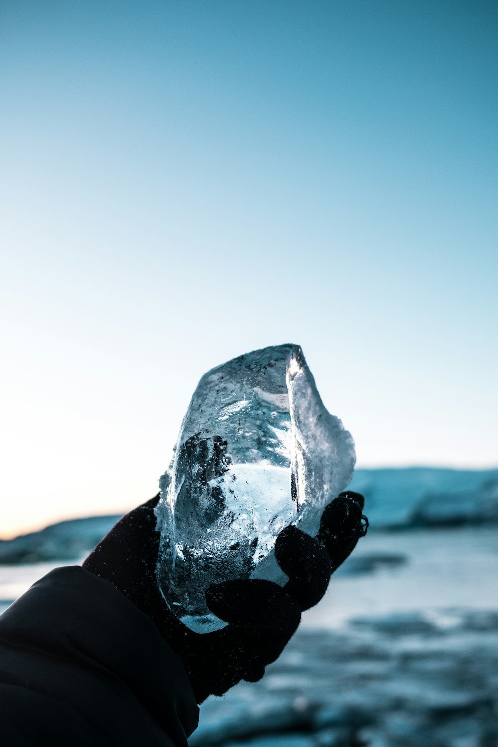 person holding block of ice