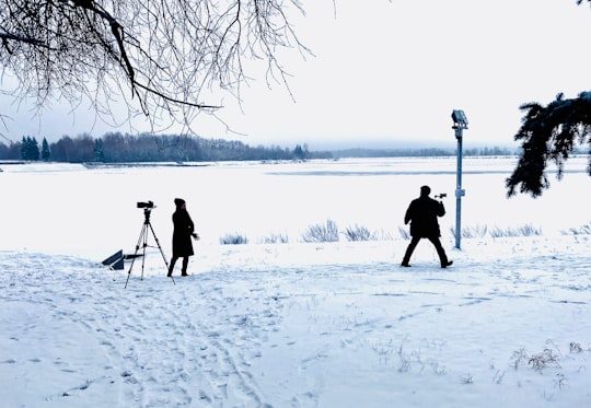 man filming on snow field in Dubna Russia