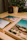 Close-up of three elegant portrait prints arranged on a wooden table.