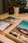 Close-up of three elegant portrait prints arranged on a wooden table.