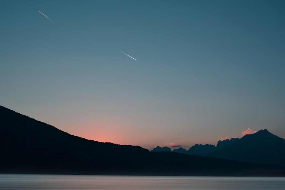 body of water under clear sky