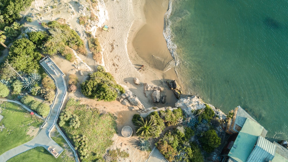 bird's-eye view photography of house beside body of water