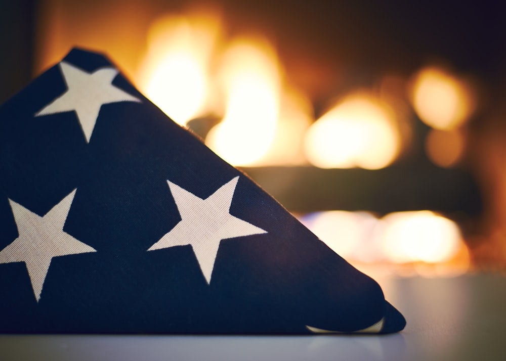 blue and white star print textile in front of bonfire