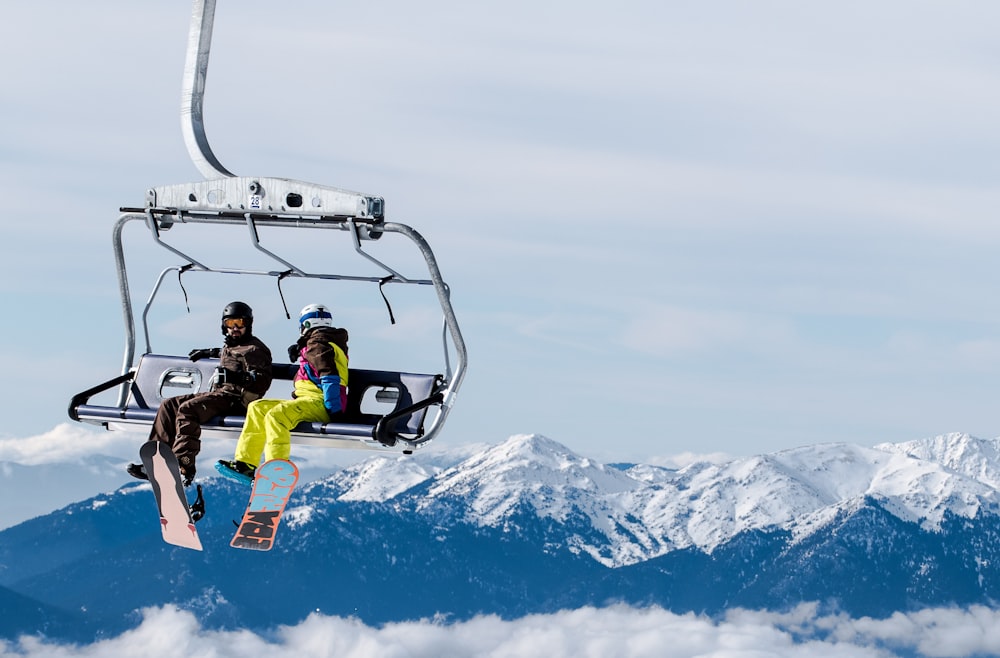 two person riding cable car