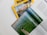 A collection of magazines with a focus on National Geographic, featuring an explorer theme. An open magazine displays an image of a person by the water, possibly involved in a fishing or marine activity, with text on the right side.