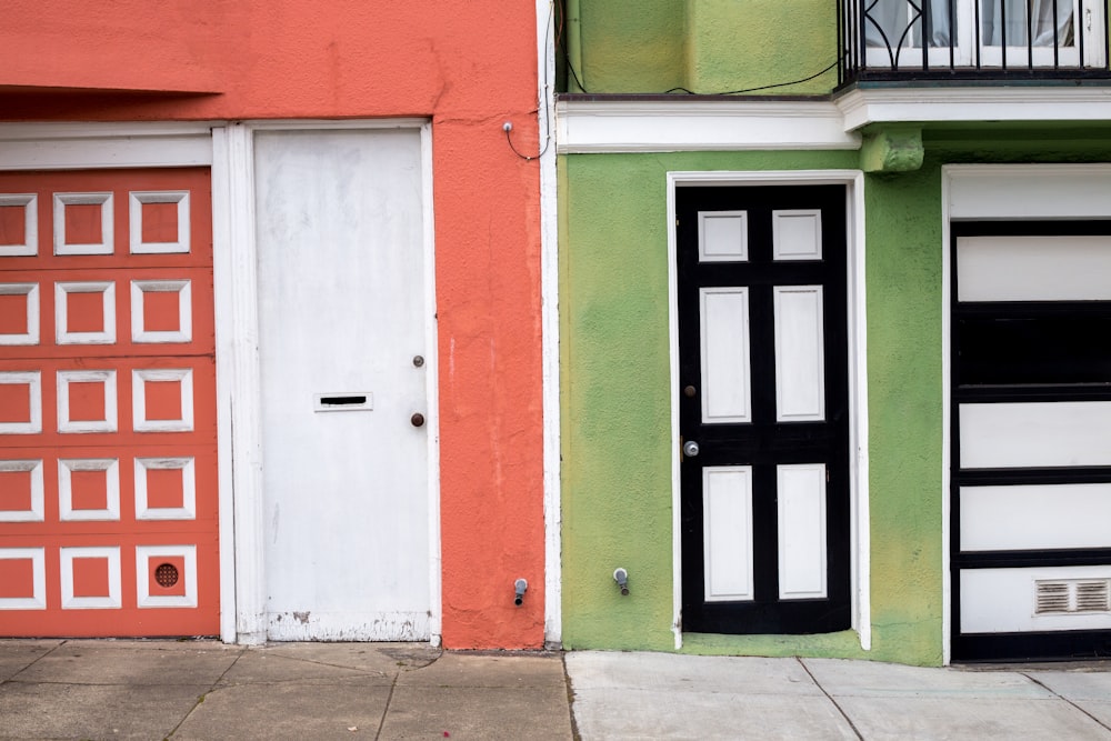 front of view of red and green houses