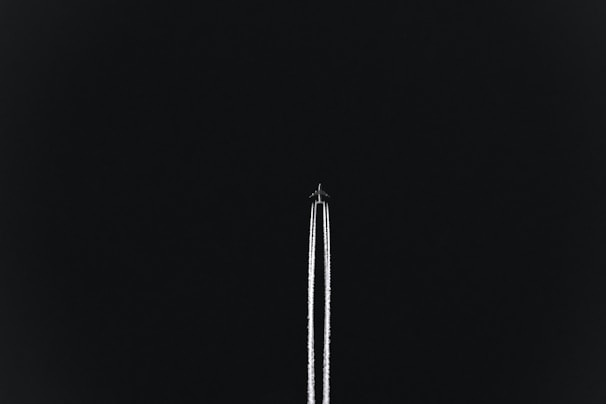 airplane with white smoke