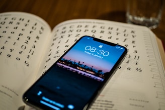 black Android smartphone on book