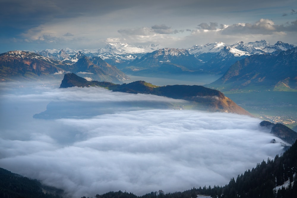 bird's eye view of mountain covered with clouds