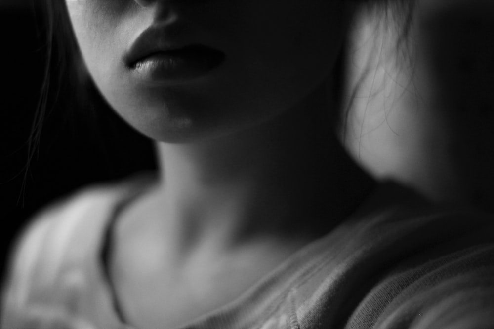 grayscale photo of woman's face