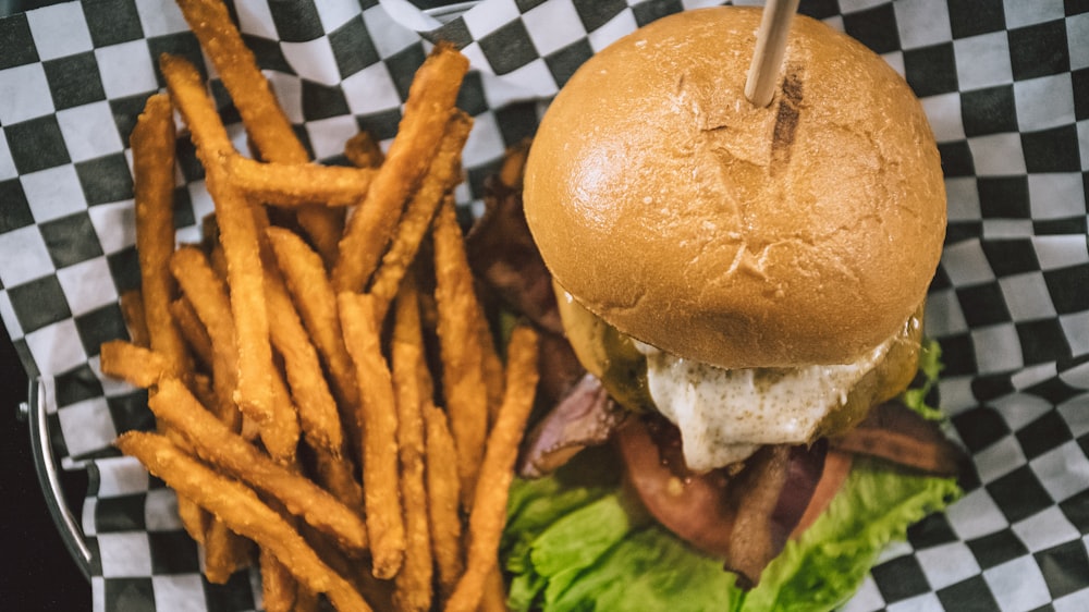 burger and fries on basket