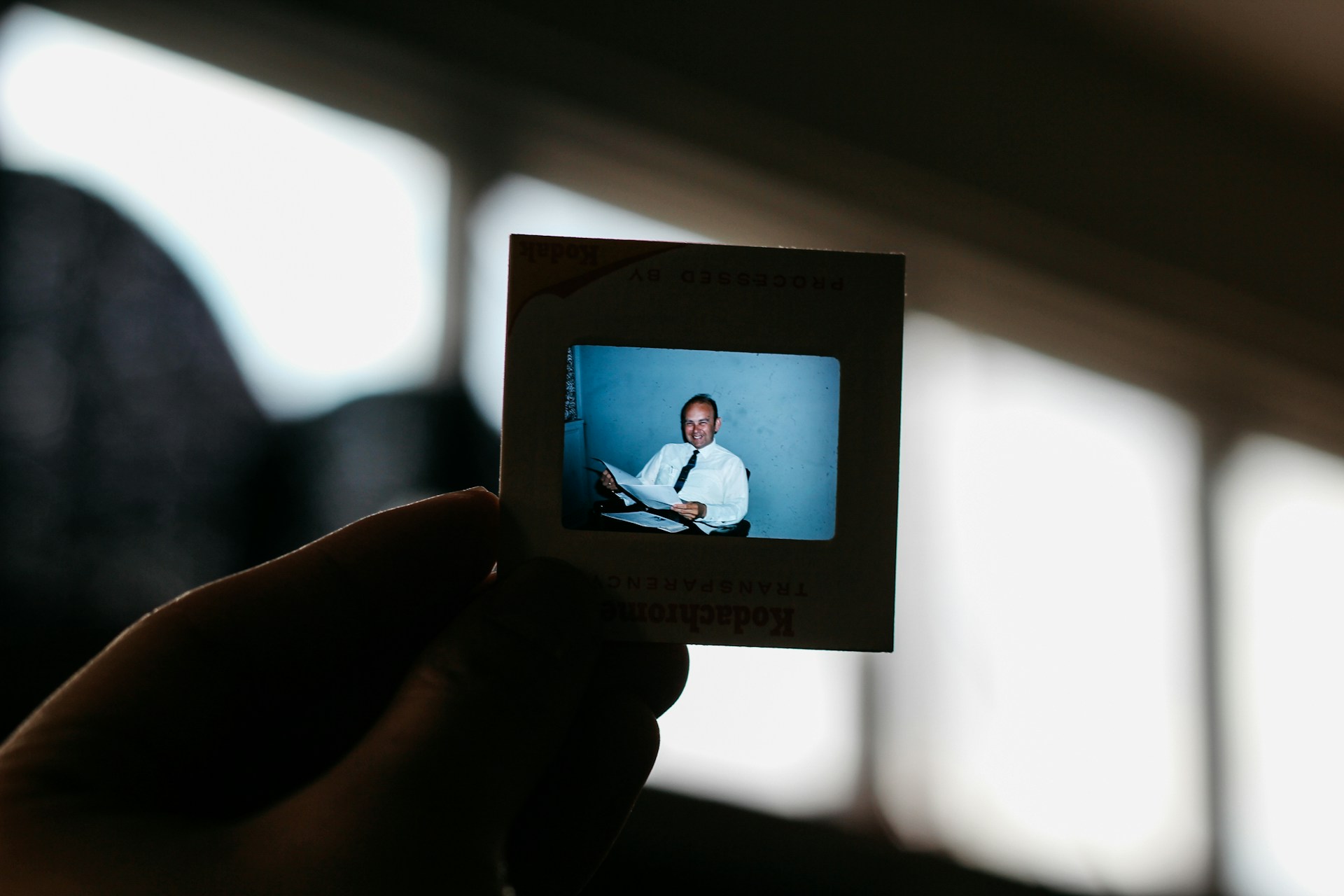 A dynamic testimonial slide displaying a customer's feedback with a smiling face.