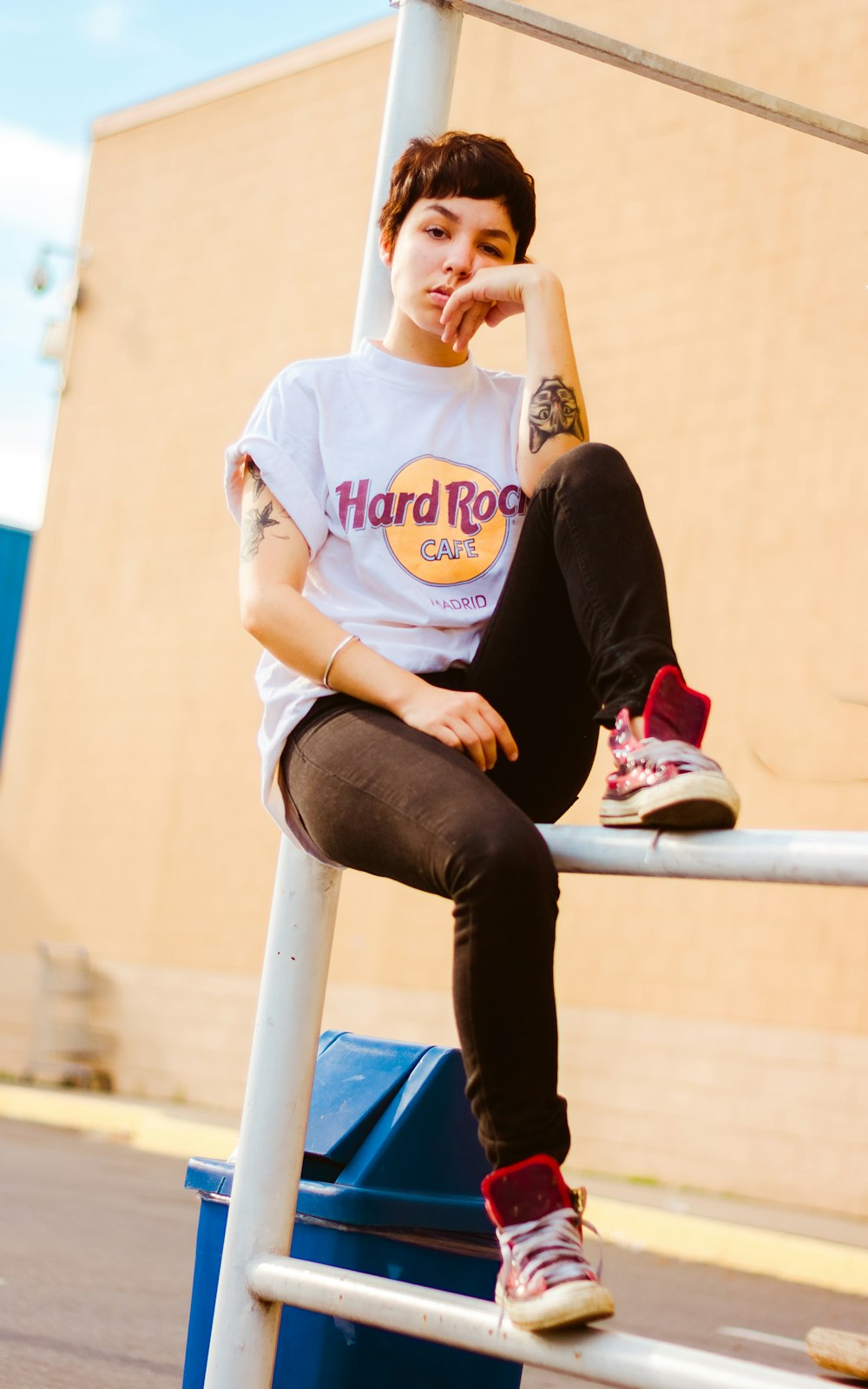 woman sitting on white scaffolding