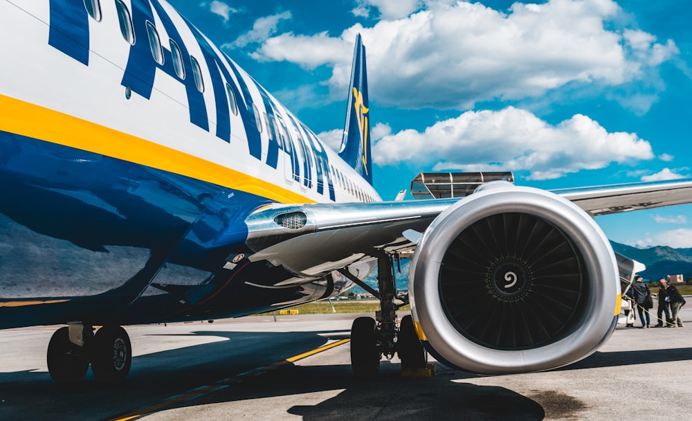 photo of blue and white passenger plane turbine