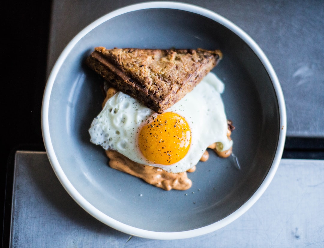 baked sandwich and fried egg in bowl