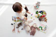 A vibrant set of interactive puzzles and games spread out on a colorful play mat.