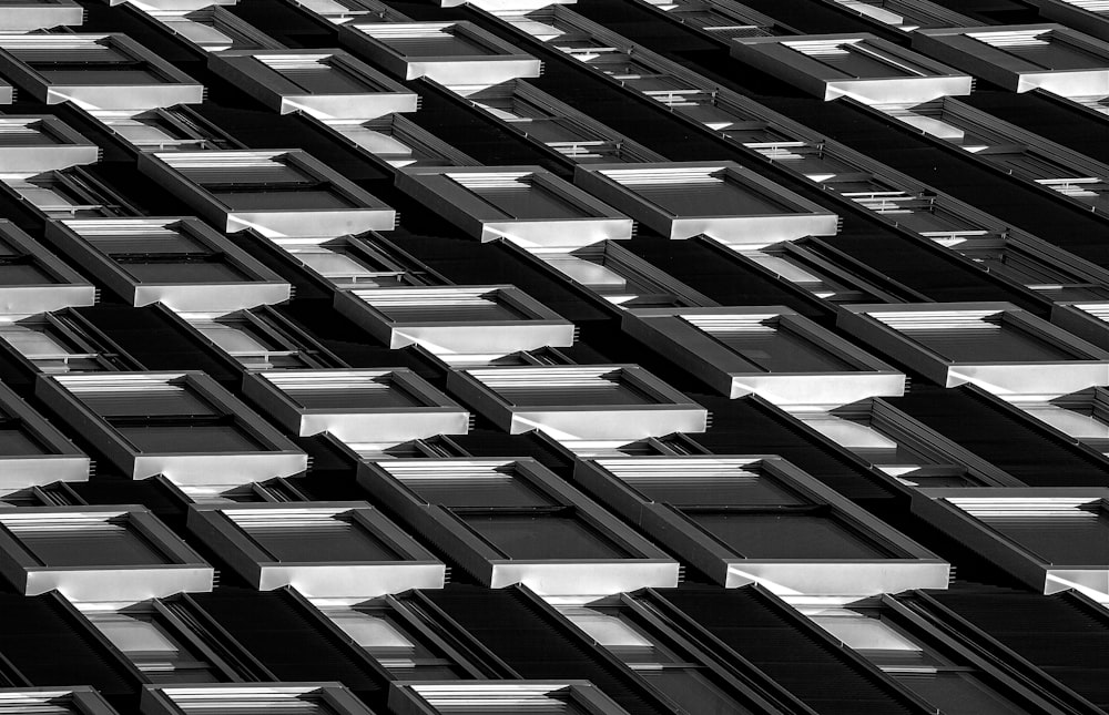 a black and white photo of windows in a building