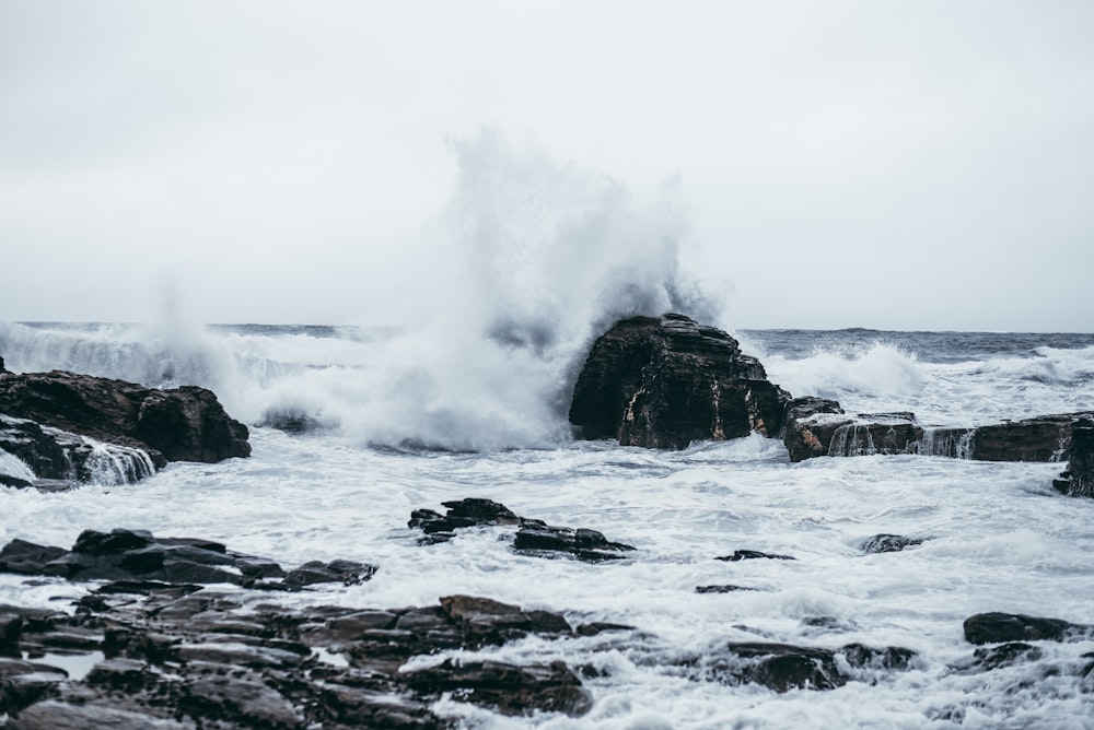 sea waves hitting rocks