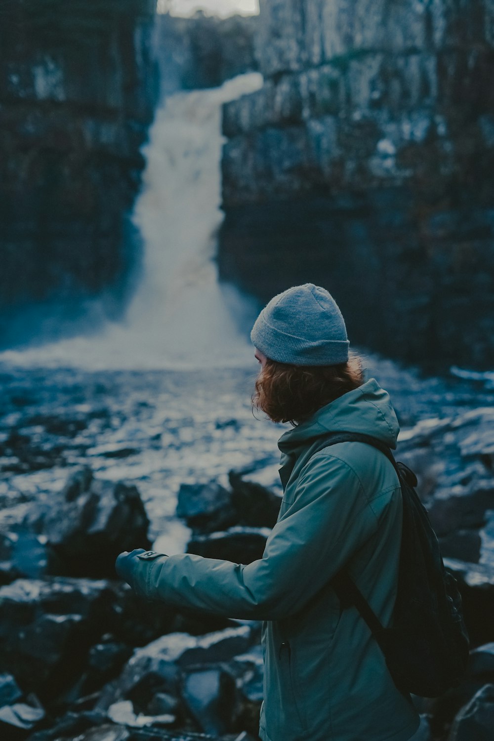 woman wearing coat near falls