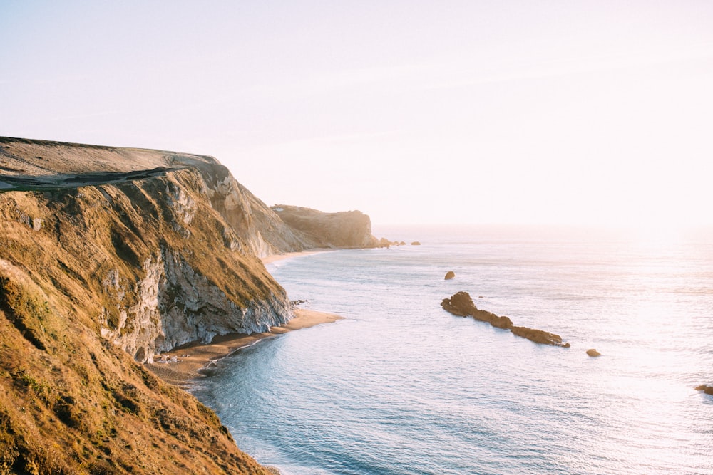 cliff near sea during daytime