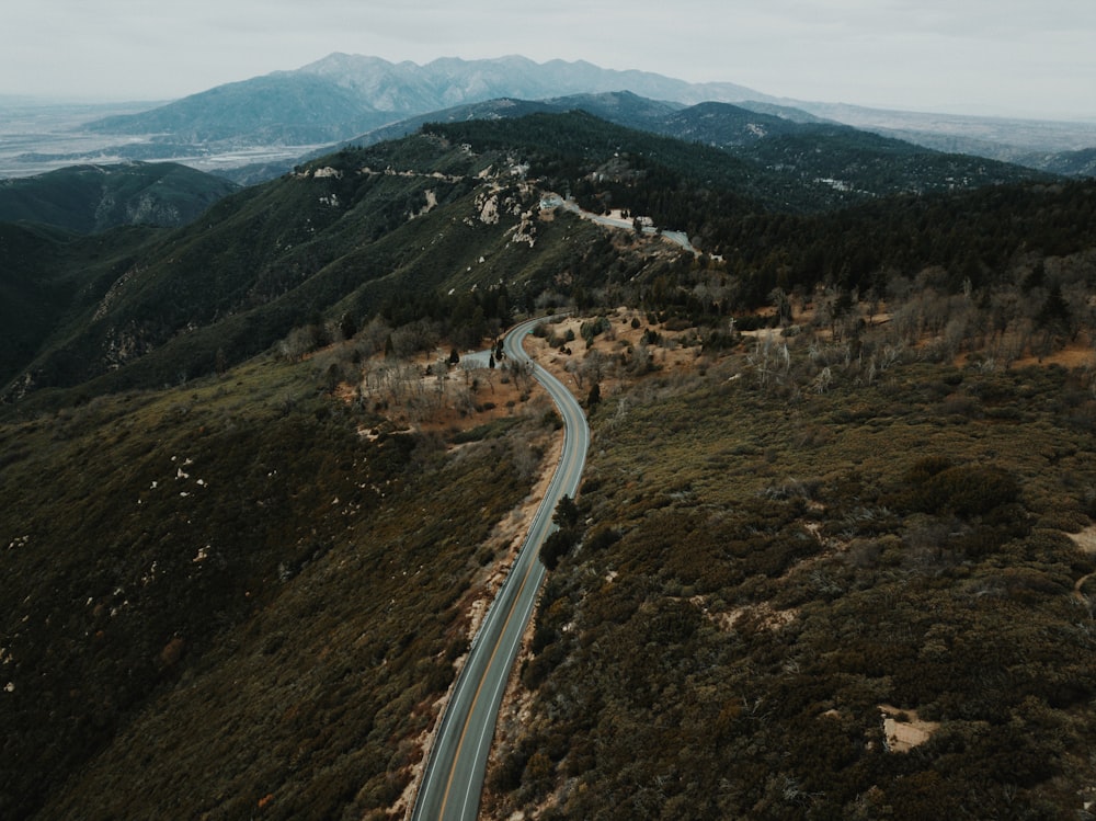 aerial view of road through mountains