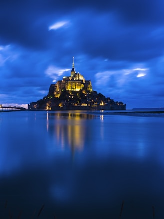 brown castle on body of water