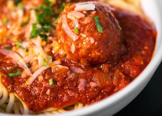 meta balls with noodles served on white ceramic bowl