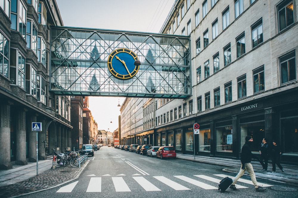 people walking on street surrounded by buildings during daytime