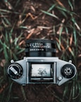 shallow focus photography of black and gray DSLR camera