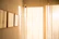 Minimalist photo of a warm beige and bordeaux-toned room with subtle celestial decorations.