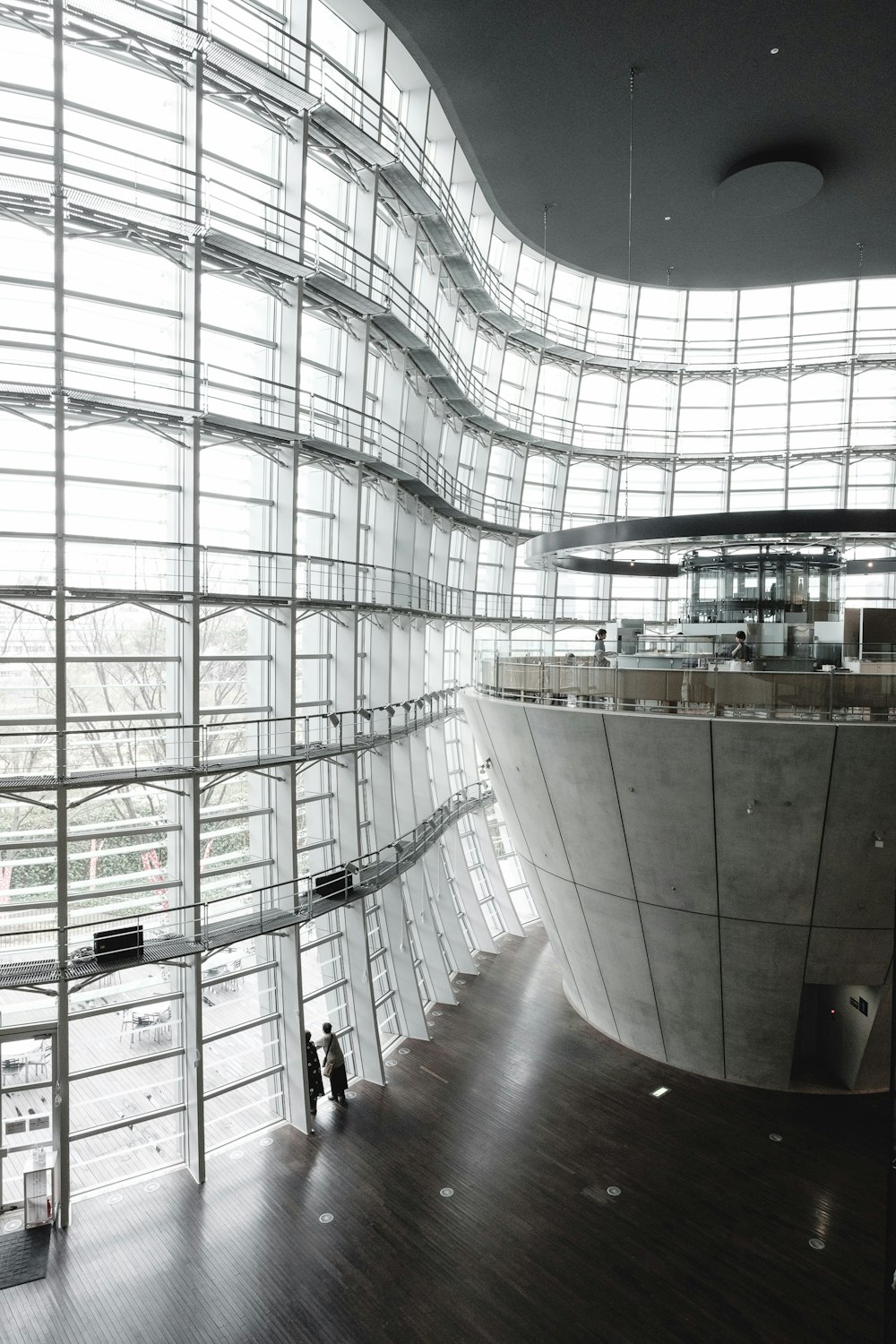 people inside building with glass walls