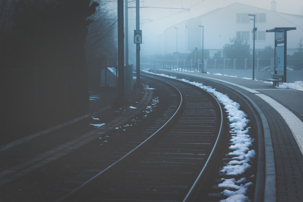 black railroad near buildings