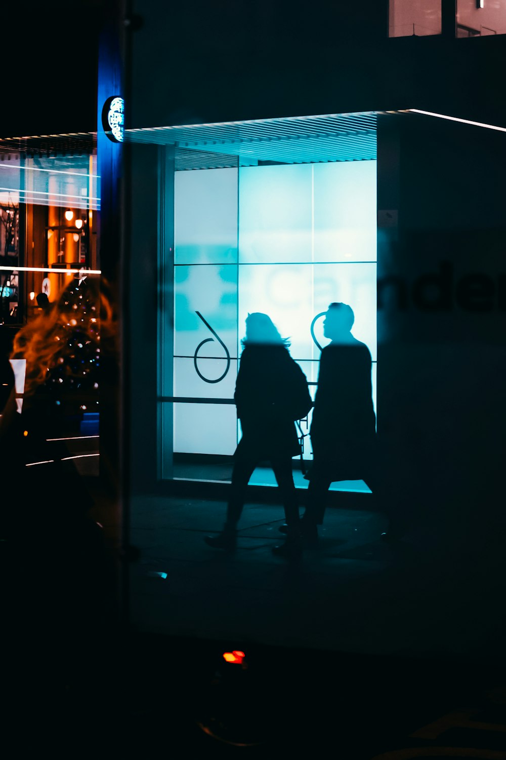 silhoutte of man and woman walking